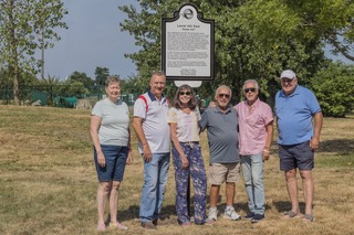 people in front of laurel hill park sign