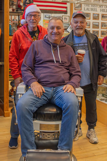 Mayor Gonnellli (seated) with Tommy Schwarz and John Buckner